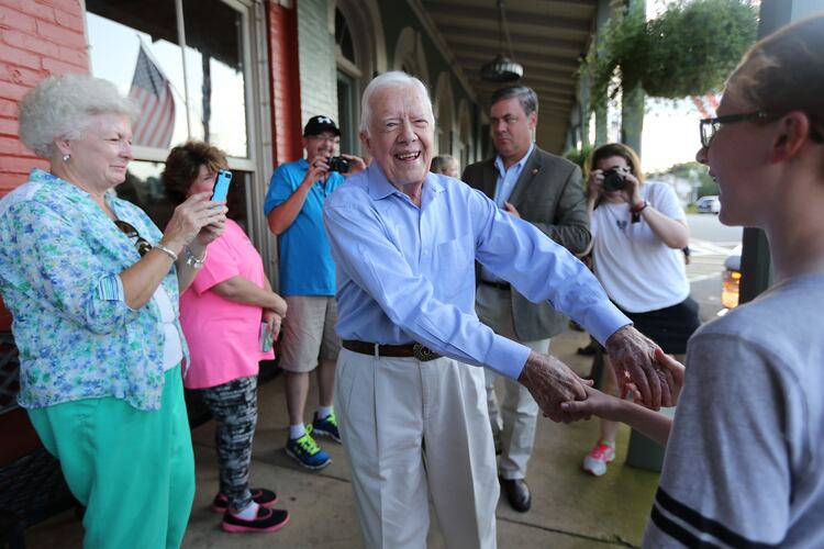 (file photo) President Jimmy Carter shakes hands as he arrives at a birthday party for his wife Rosalynn on Saturday August 22, 2015 in Plains, Georgia. Ben Gray / bgray@ajc.com