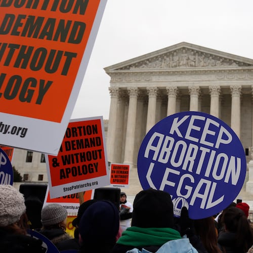 Abortion rights and anti-abortion rights activists protest in front of the U.S. Supreme Court in Washington, D.C. The mother of an Atlanta-area woman says her pregnant daughter was declared brain-dead more than three months ago, but Georgia’s abortion law has caused doctors to keep the woman on life support. (Associated Press file photo)