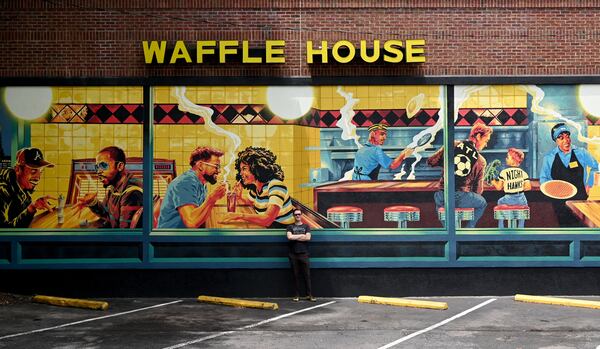 Artist Nick Benson painted a comforting Atlanta scene on a downtown Waffle House. (Hyosub Shin/AJC)