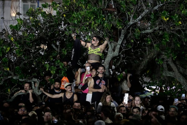 Fans watch Lady Gaga rehearse a day ahead of her free concert, on Copacabana beach, in Rio de Janeiro, Friday, May 2, 2025. (AP Photo/Bruna Prado)
