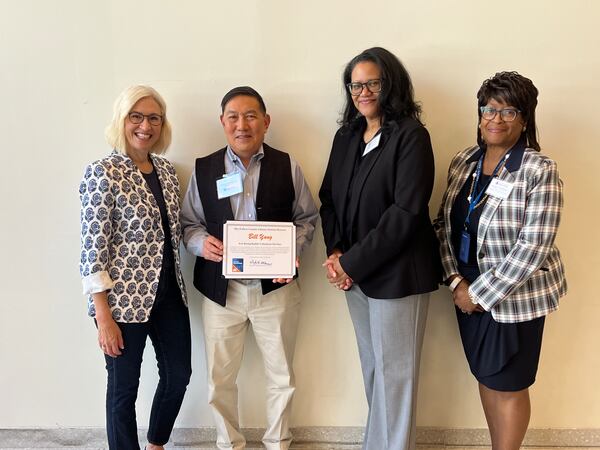 From left: Fulton County District 3 Commissioner Dana Barrett, Fulton County Library System Adult Volunteer of the Year Bill Yang, former Chair of the Library Board of Trustees Priscilla Borders and Fulton County Library system Executive Director Gayle H. Holloman. (Contributed by Fulton County)