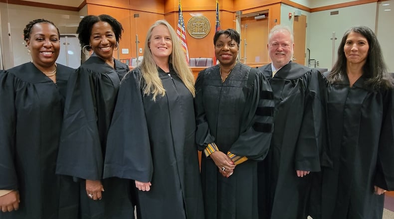 Chief Magistrate Court Judge Berryl Anderson (center right) is joined by new judges (from left) Tamara Williams, Teri Thompson, Elizabeth Guerrant, Thomas Kemp III and Mirna Andrews.