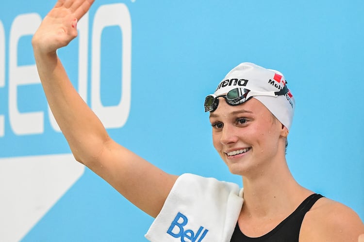Summer McIntosh waves to fans after setting a new world in the women's 200m butterfly final at the Canadian Swimming Trials in Montreal, on Sunday, July 5, 2026. (Graham Hughes/The Canadian Press via AP)