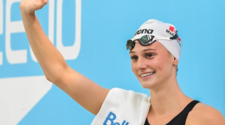 Summer McIntosh waves to fans after setting a new world in the women's 200m butterfly final at the Canadian Swimming Trials in Montreal, on Sunday, July 5, 2026. (Graham Hughes/The Canadian Press via AP)
