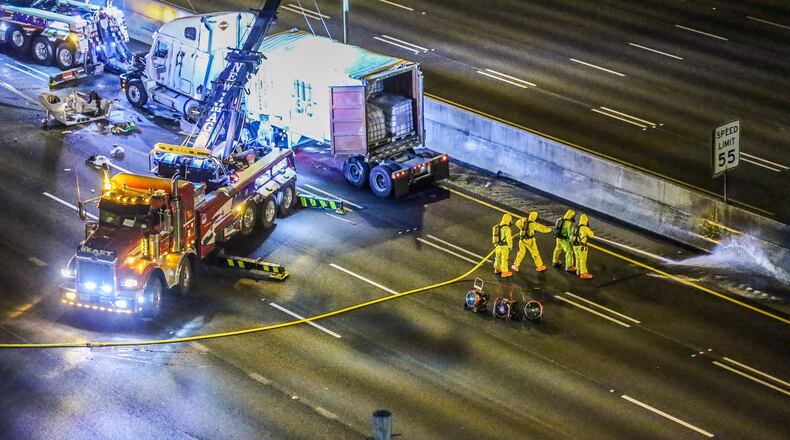 An overturned tractor trailer hauling benzoyl chloride snarled traffic in downtown Atlanta for hours on Monday. John Spink/jspink@ajc.com