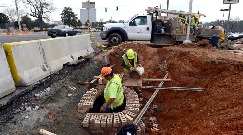 Johns Creek plans monthly meetings through this summer to keep the public updated on proposals to widen Jones Bridge and McGinnis Ferry roads. AJC file photo by HYOSUB SHIN / HSHIN@AJC.COM