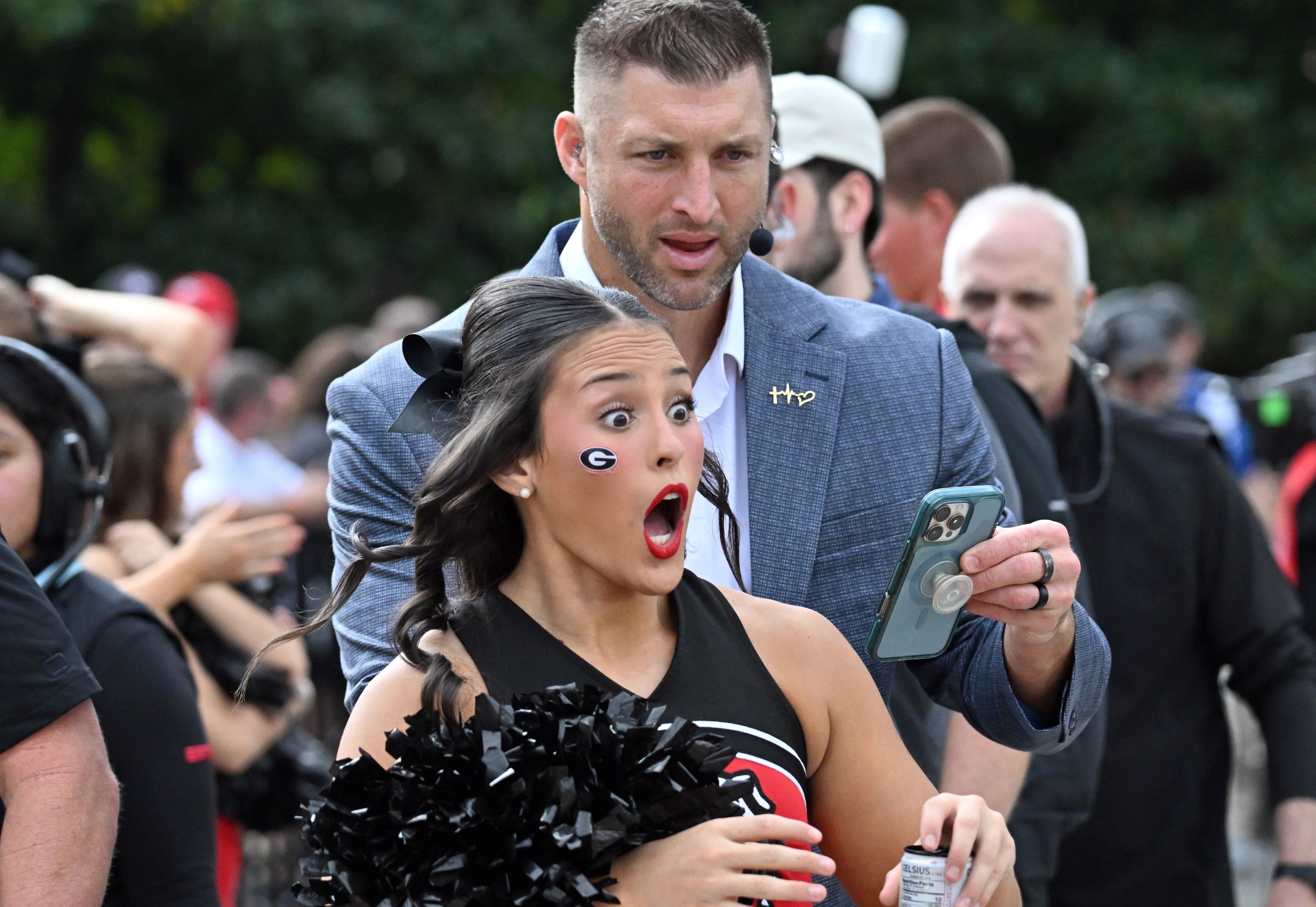 A member of Spirit Squad reacts as she recognizes Tim Tebow (behind) prior to an NCAA football game against Mississippi State at Davis Wade Stadium, Saturday, November 8, 2025, in Starkville, Mississippi. (Hyosub Shin / AJC)