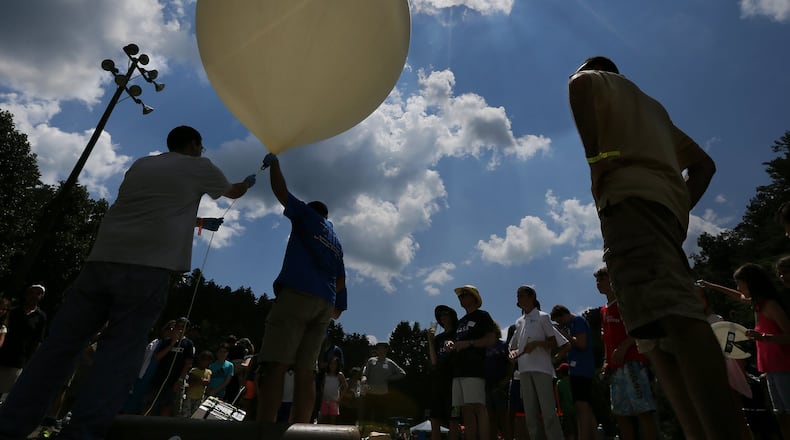Georgia Tech professor Morris B. Cohen (right) looks on as engineering students prepare to launch a balloon to 100,000 feet. Cohen conducted an experiment during the 2017 total eclipse at a Rabun County summer camp called Ramah Darom. CURTIS COMPTON / CCOMPTON@AJC.COM