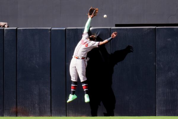 Braves center fielder Michael Harris II couldn't quite grab a Padres home run on opening day. (Gregory Bull/AP)