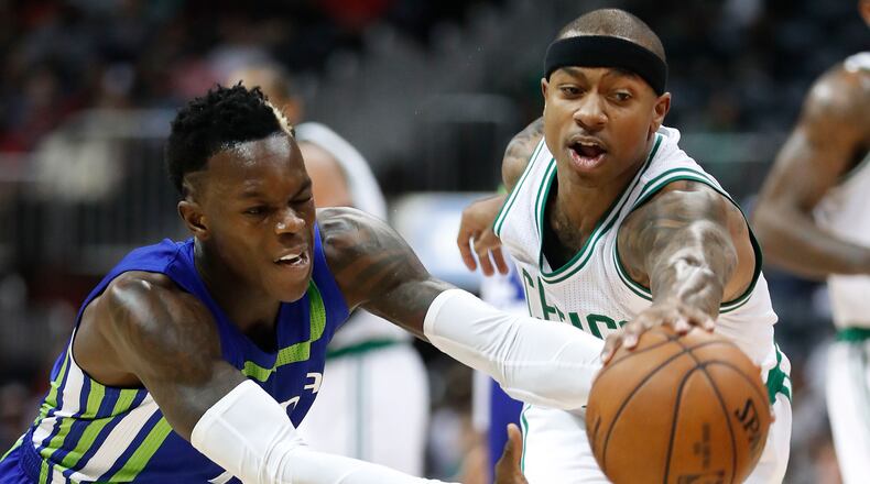 Atlanta Hawks guard Dennis Schroder, left, and Boston Celtics guard Isaiah Thomas chase down a loose ball during the first half of an NBA college basketball game Friday, Jan. 13, 2017, in Atlanta. (AP Photo/John Bazemore)