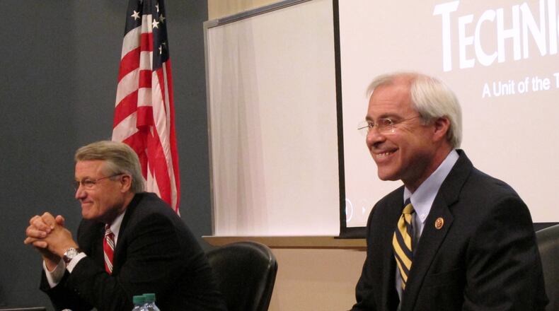 FILE - In this Oct. 16, 2014 file photo Georgia Republican Congressional candidate Rick Allen, left, and Rep. John Barrow, D-Ga. wait for their debate to begin in Statesboro, Ga. How high can Republicans go Tuesday night in padding their House majority? The GOP currently holds 233 of 435 seats _ 234 if you count former Majority Leader Eric Cantors open Virginia seat that is expected to remain in the Republican column. (AP Photo/Russ Bynum, File)