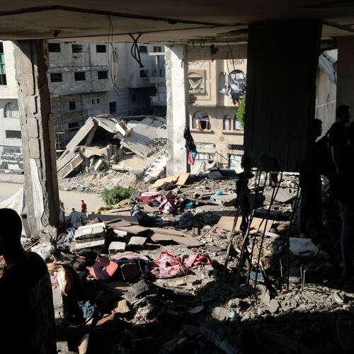 Residents inspect the site of an Israeli airstrike in Gaza city, Saturday, July 18, 2026. (AP Photo/Jehad Alshrafi)