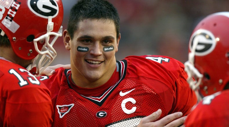 Georgia senior David Pollack (47) greets his teammates for the last time at Sanford Stadium during introductions at the Georgia Tech game Saturday, Nov. 27, 2004.
