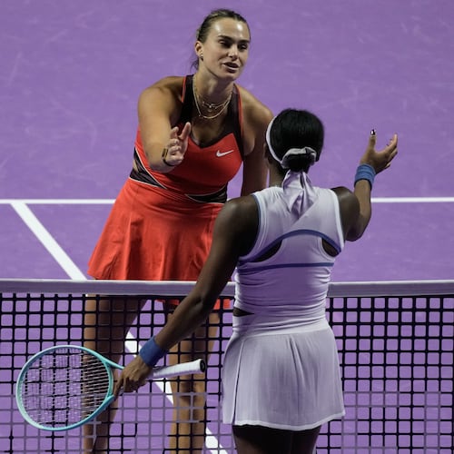 Aryna Sabalenka of Belarus, left, greets her opponent Coco Gauff of the United States after winning the women's singles match at the WTA tennis finals in Riyadh, Saudi Arabia, Thursday, Nov. 6, 2025. (AP Photo/Fatima Shbair)