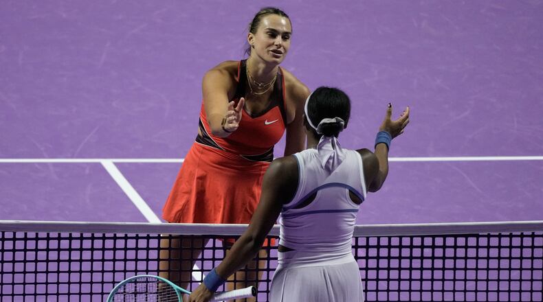 Aryna Sabalenka of Belarus, left, greets her opponent Coco Gauff of the United States after winning the women's singles match at the WTA tennis finals in Riyadh, Saudi Arabia, Thursday, Nov. 6, 2025. (AP Photo/Fatima Shbair)