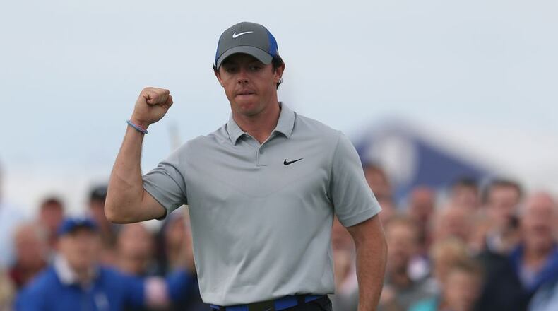Rory McIlroy on his way to winning the British Open and his dad's bet. (Jon Super/AP)