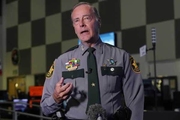 Collier County Sheriff Kevin Rambosk explains the upgrades to the technology used by emergency responders, Friday, July 11, 2025, in Naples, Fla., at the Collier County Emergency Services Center. (AP Photo/Marta Lavandier)