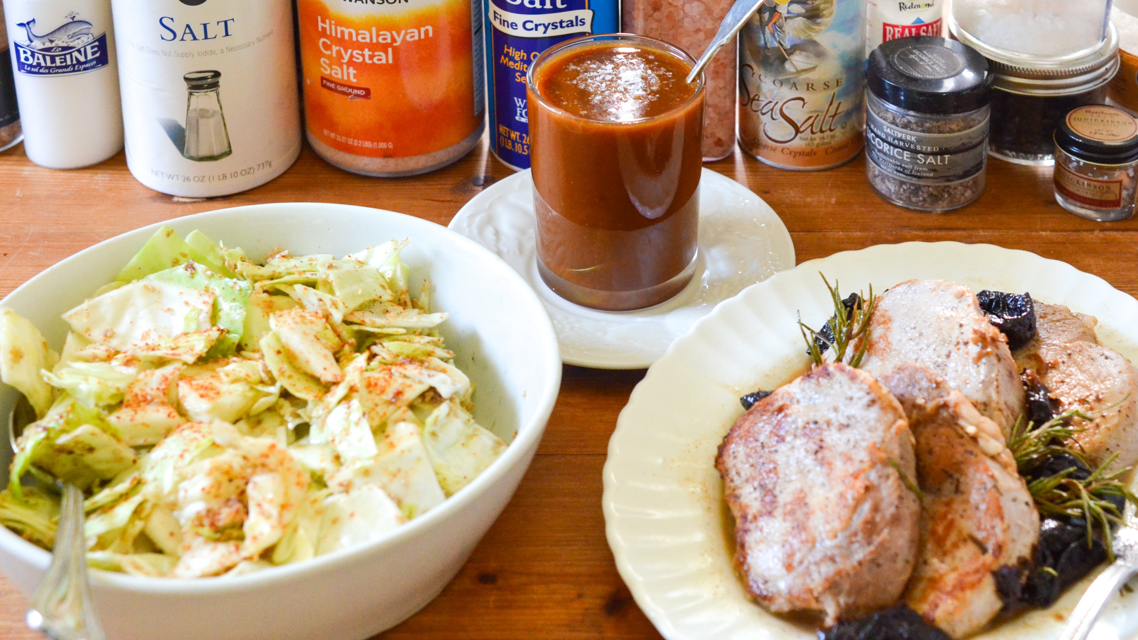 Celebrate salt smartly with these recipes for brined pork chops with rosemary and prunes, yamitsuki and salted caramel sauce. (Virginia Willis for the AJC)