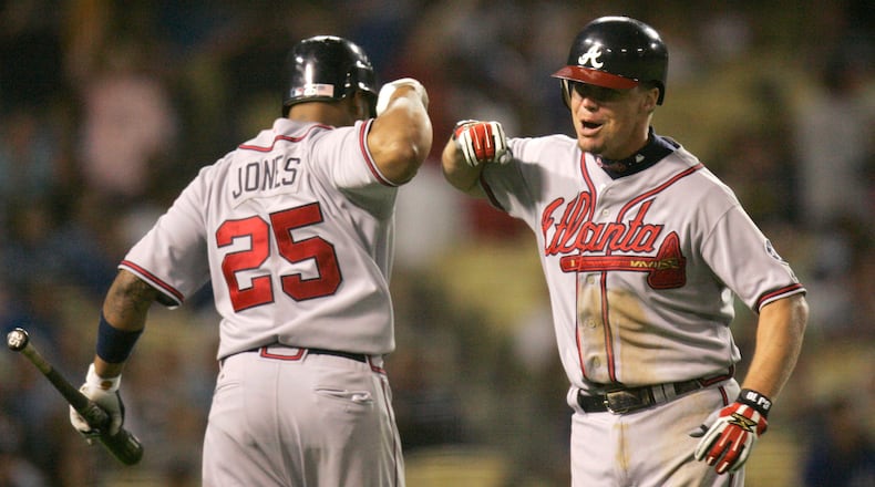 Atlanta Braves' Chipper Jones, right, is congratulated by teammate Andruw Jones after Chipper Jones homered during the eighth inning of the Braves' baseball game against the Los Angeles Dodgers, Thursday, July 5, 2007, in Los Angeles.