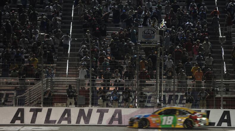 September 1, 2013 - Hampton: Kyle Busch crosses the finish line to win the Advocare 500 at Atlanta Motor Speedway on Sunday, September 1, 2013. JOHNNY CRAWFORD / JCRAWFORD@AJC.COM