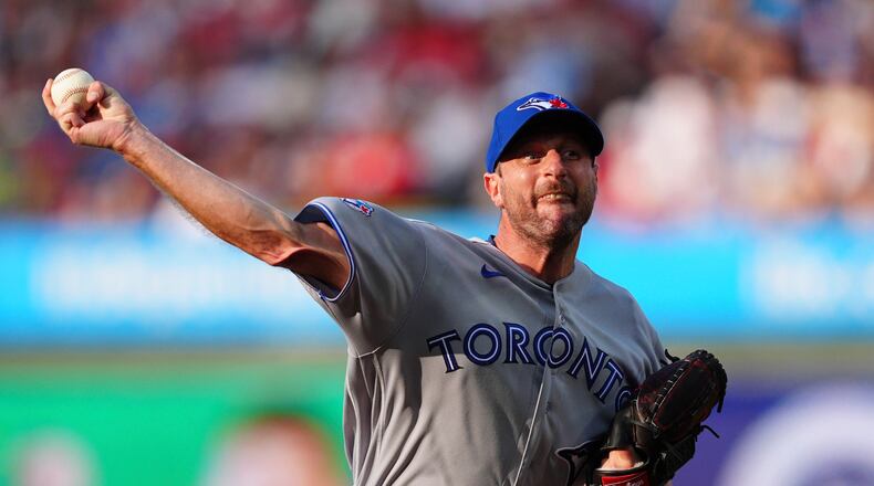 Toronto Blue Jays pitcher Max Scherzer throws during the first inning of a baseball game against the Philadelphia Phillies, Saturday, Aug. 8, 2026, in Philadelphia. (AP Photo/Derik Hamilton)