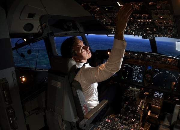 Capt. Miles Morgan, managing director of flight training for United Airlines, flies a simulator at the company's training campus in Denver, Friday, May 16, 2025. (AP Photo/Thomas Peipert)