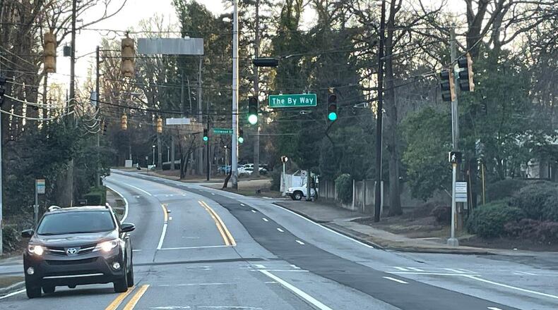 A dedicated left-hand turn signal at this traffic light is sought at this busy location.
