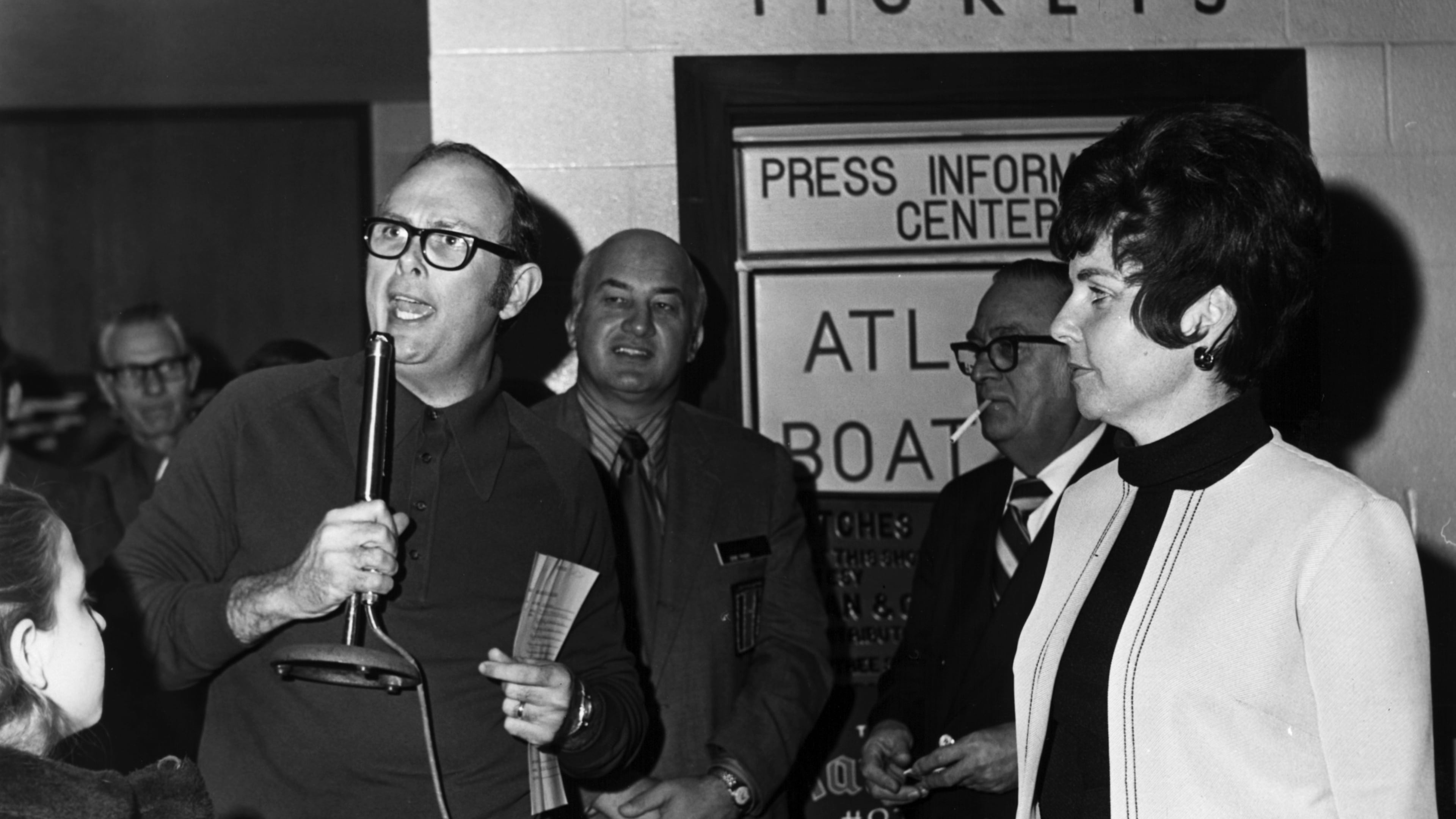 In 1972, John Moore addresses a crowd for the WSB Fish Tale contest at the Atlanta Boat Show. (Courtesy WSB Radio archives)