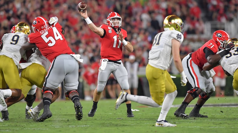 Georgia quarterback Jake Fromm (11) gets off a pass during the first half in a NCAA college football at Sanford Stadium in Athens on Saturday, September 21, 2019. Georgia defeated Notre Dame 23-17. (Hyosub Shin / Hyosub.Shin@ajc.com)