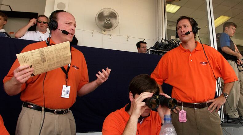 Rod Bramblett, left, where he did some of his best work, a football press box. (Photo by Todd J Van Emst/Auburn Athletics)