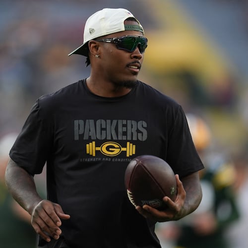 FILE - Green Bay Packers running back Josh Jacobs stands on the field before a NFL preseason football game against the Arizona Cardinals, Aug. 28, 2026, in Green Bay, Wis. (AP Photo/Abbie Parr, File)