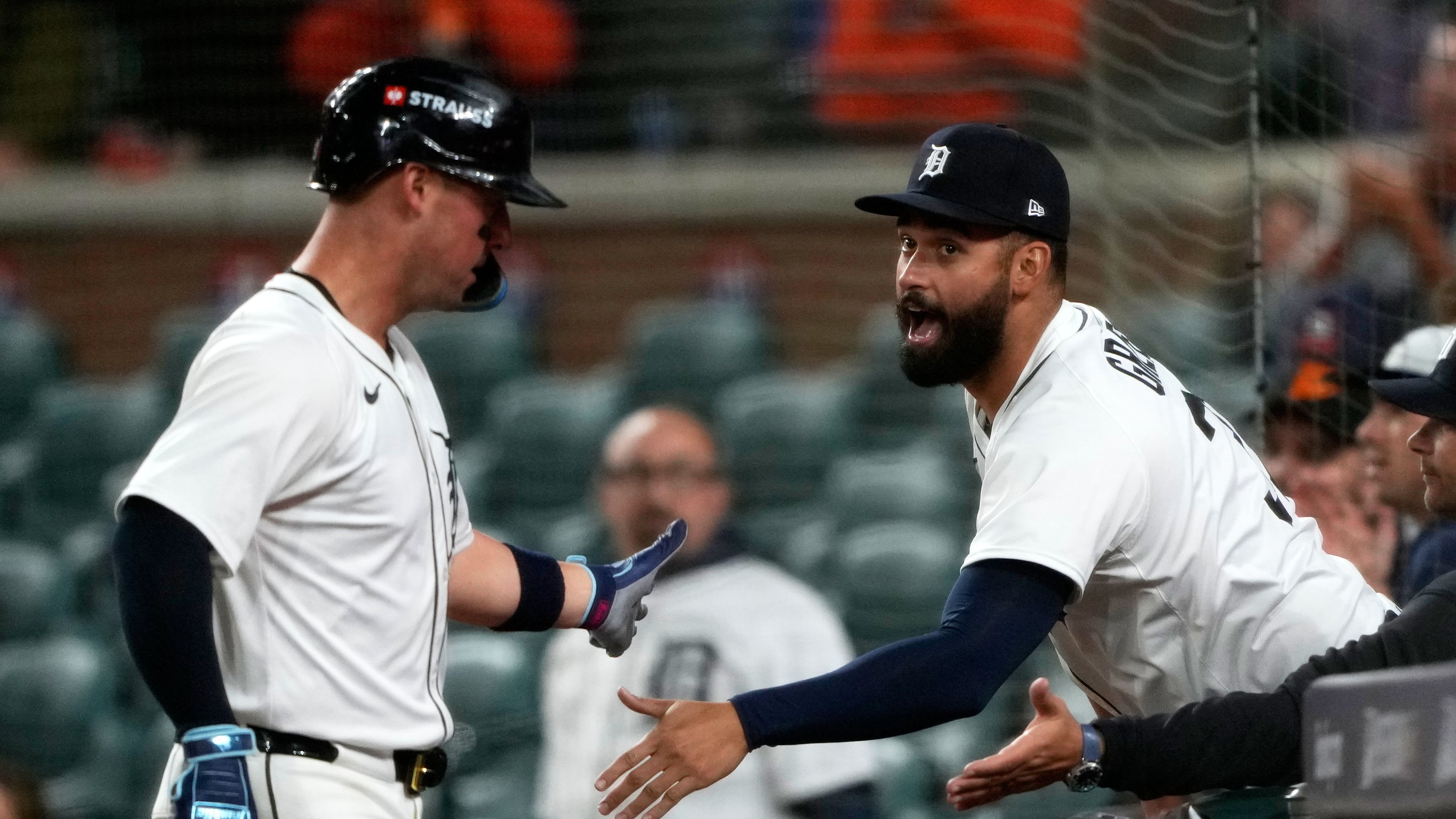Detroit Tigers' Spencer Torkelson, left, is congratulated by teammate Riley Greene after scoring during the ninth inning in Game 3 of baseball's American League Division Series against the Seattle Mariners Tuesday, Oct. 7, 2025, in Detroit. (AP Photo/Ryan Sun)