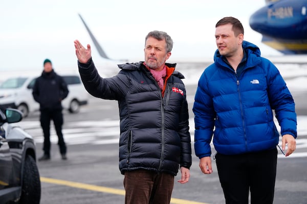 Denmarks King Frederik, left, and Greenland's Prime Minister, Jens-Frederik Nielsen, right, arrive in Nuuk, Greenland, Tuesday, April 29, 2025. (Ida Marie Odgaard/Ritzau Scanpix via AP)