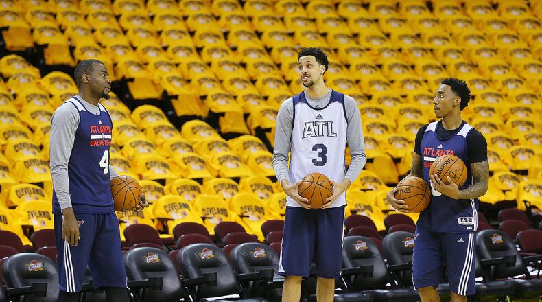 Hawks Paul Millsap (from left), Austin Daye and Jeff Teague participate in team shoot around at Quicken Loans Arena in preparation for game 4 against the Cavaliers in the Eastern Conference Finals on Tuesday, May 26, 2015, in Cleveland. Curtis Compton / ccompton@ajc.com