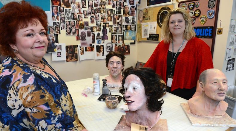 PASSING THE PENCIL--MAY 31, 2013 DECATUR Marla Lawson and her daughter Kelly, are shown in the work area of the GBI sketch lab Friday, May 31, 2013. Like Cher and Madona, Marla Lawson is known in the criminal justice community by just one name: Marla. In the criminal justice world she is a rock star. The self-taught artist has put faces with some of Georgia's infamous and not-so-infamous crimes. She has used clay to reconstruct human remains in the hopes family and friends might recognize a resemblance to a lost loved-one. Her sketch of Olympic Park bomber Eric Robert Rudolph could not have been more exact if he sat for the drawing. She once produced a sketch of an armed robbery suspect even though she only a portion of his face as a basis. But now she is retiring. Again. This time it may be permanent as she is training her daughter, Kelly Lawson, to take her place at the Georgia Bureau of Investigation. KENT D. JOHNSON / KDJOHNSON@AJC.COM