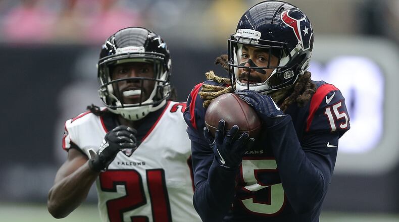 Texans wide receiver Will Fuller catches a pass for a 44-yard touchdown ahead of the Falcons' Desmond Trufant in the fourth quarter Oct. 6, 2019, at NRG Stadium in Houston.