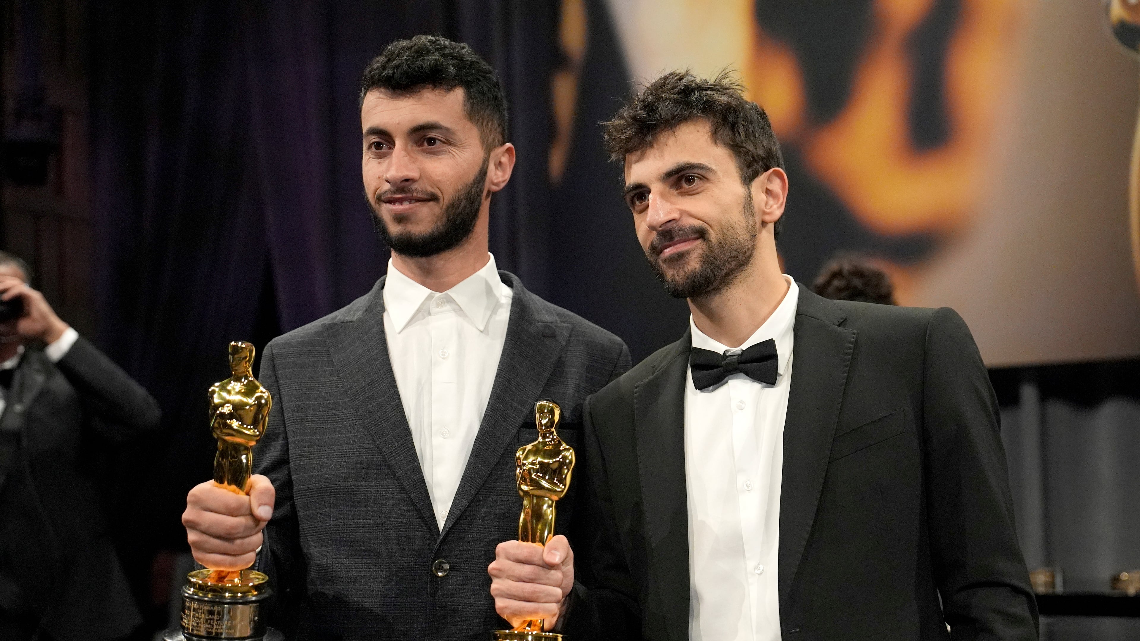 FILE - Basel Adra, left, and Yuval Abraham, winners of the Oscar for best documentary feature film for "No Other Land," pose for photos at the Governors Ball, in Los Angeles, March 2, 2025. (AP Photo/John Locher, File)