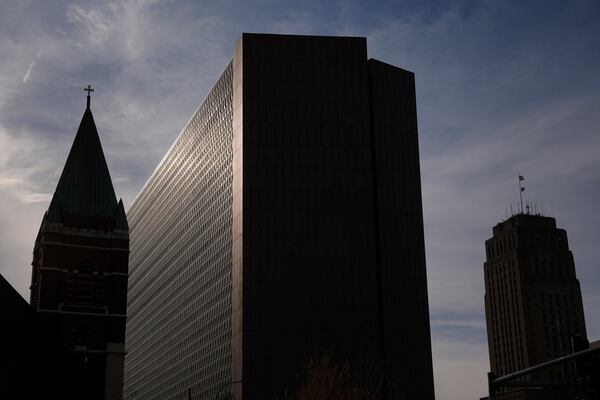 The Richard Bolling federal building, at center, rises among other downtown landmarks, Sunday, April 13, 2025, in Kansas City, Mo. (AP Photo/Charlie Riedel)