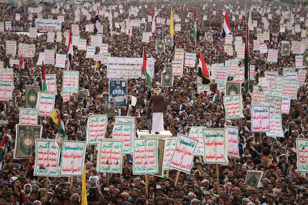 Houthi supporters hold signs during a weekly anti-U.S. and anti-Israel rally in Sanaa, Yemen, Friday March, 28, 2025. (AP Photo/Osamah Abdulrahman)