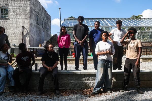 Students of the Oakland Roots Academy introduce themselves at the Oakland Cemetery in Atlanta on Thursday, July 16, 2026. (Abbey Cutrer/AJC)