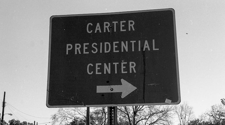 A sign points the way to the Carter Presidential Center. (Jeremy Fletcher)
