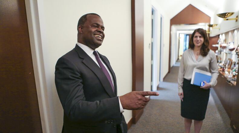 Former Mayor Kasim Reed (left) and his then-press secretary, Jenna Garland (right), in 2015. Garland’s text messages instructing another city employee to delay an open records are the subject of a GBI criminal investigation. JOHN SPINK / JSPINK@AJC.COM