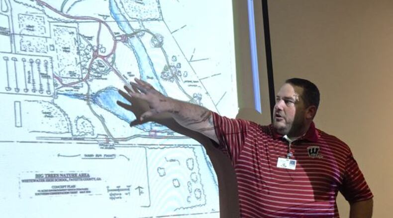 Whitewater High School biology teacher Tom Hill showed the Board of Education a plan for the new Big Trees Nature Area. Photo by Jill Howard Church for the AJC.