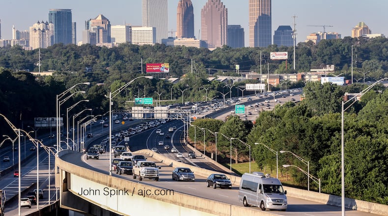 Traffic builds on the first Monday morning commute since the I-85 reopening. JOHN SPINK / JSPINK@AJC.COM