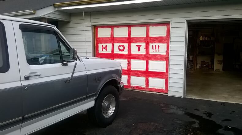 Neighbors said William Arnett changed in recent months and painted his garage doors. (Credit: Carolyn Cunningham)