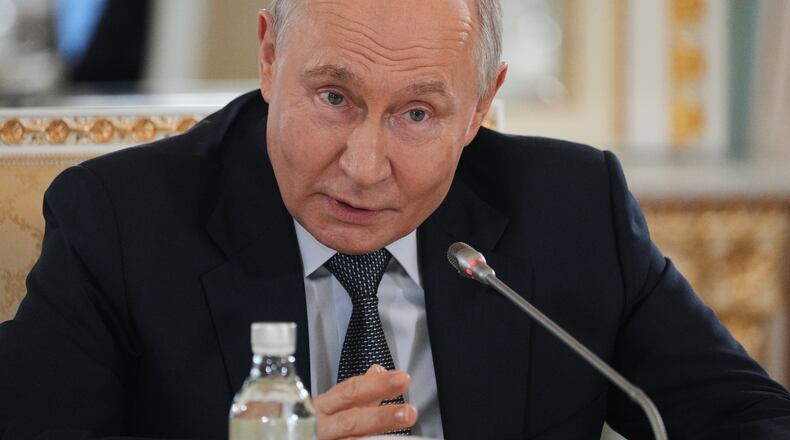 Russian President Vladimir Putin speaks to representatives of international news agencies on the sidelines of the St. Petersburg International Economic Forum at the Constantine Palace in St. Petersburg, Russia, on Thursday, June 4, 2026. (AP Photo/Dmitri Lovetsky, Pool)