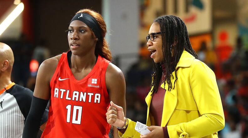 Rhyne Howard (left) and coach Tanisha Wright had strong first seasons with the Dream. The Dream signed Wright and general manager Dan Padover to five-year contract extensions. (File photo)