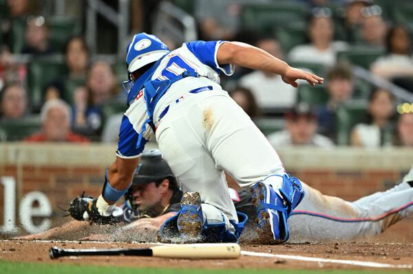 Braves catcher Drake Baldwin tags out Miami's Graham Pauley during the sixth-inning of Saturday's loss.
