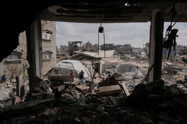 Palestinians look at the damage after an Israeli army airstrike in Beit Lahia, northern Gaza Strip, Monday, April 28, 2025. (AP Photo/Jehad Alshrafi)