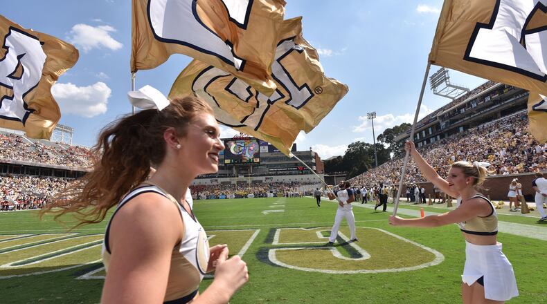 Georgia Tech cheerleading team cheer after quarterback Justin Thomas scored a touchdown against the Mercer Bears in the first half at Bobby Dodd Stadium on Saturday, September 10, 2016. HYOSUB SHIN / HSHIN@AJC.COM